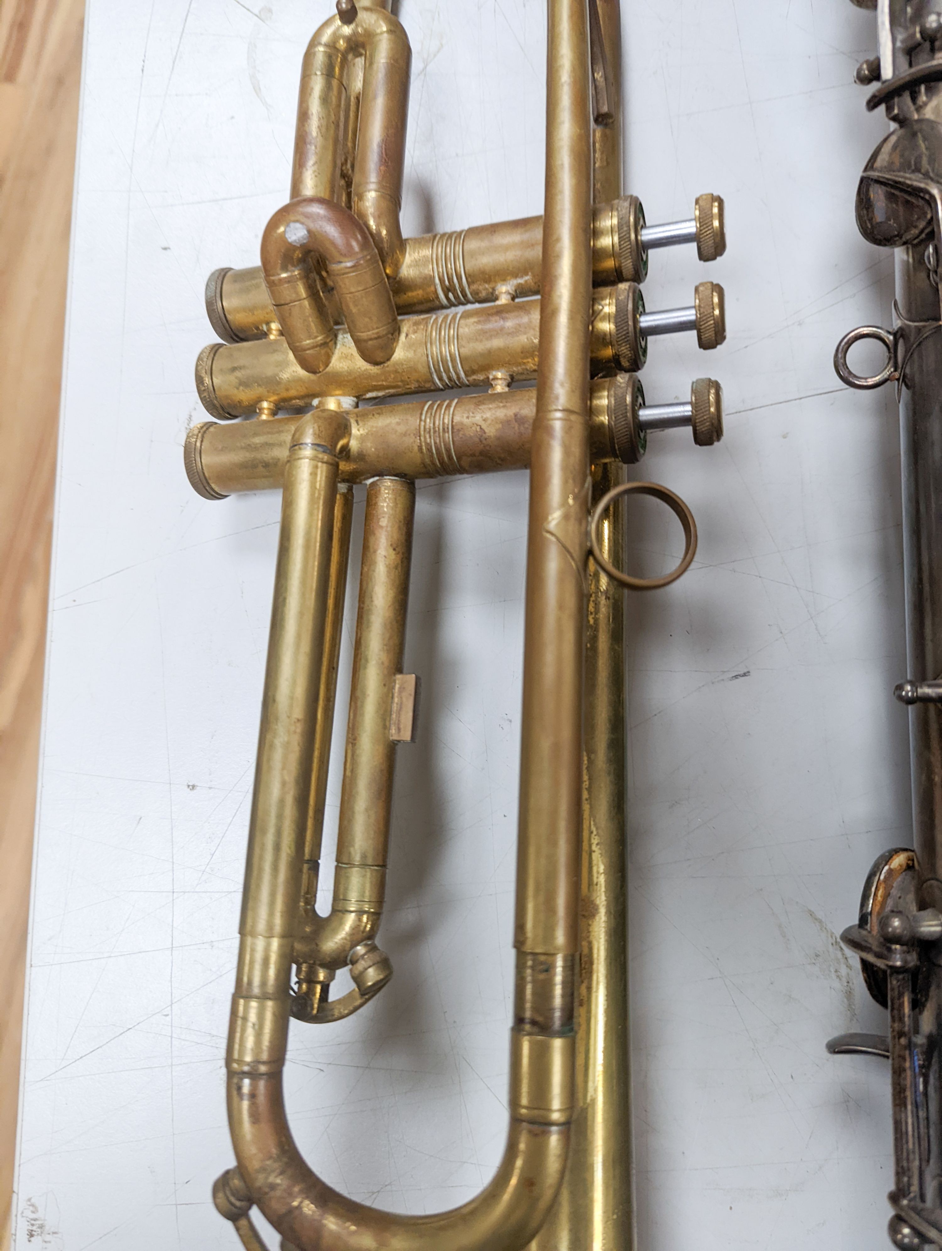 An Excelsior sonorous class A Hawkes & Son saxophone, and a Grafton Dallas, London trumpet with accessories